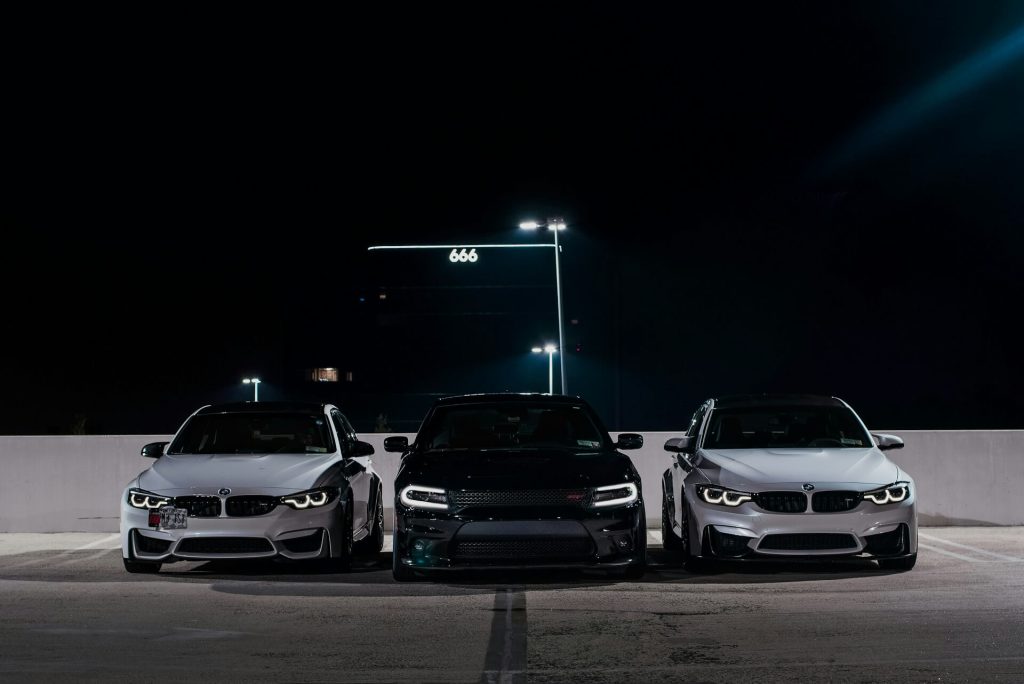 three cars parked at night